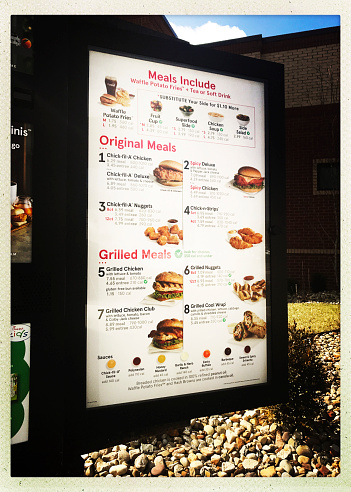 Pittsburgh, USA   March 15, 2018   Chick -Fil-A menu board in drive thru of the McKnight Road restaurant.  iPhone