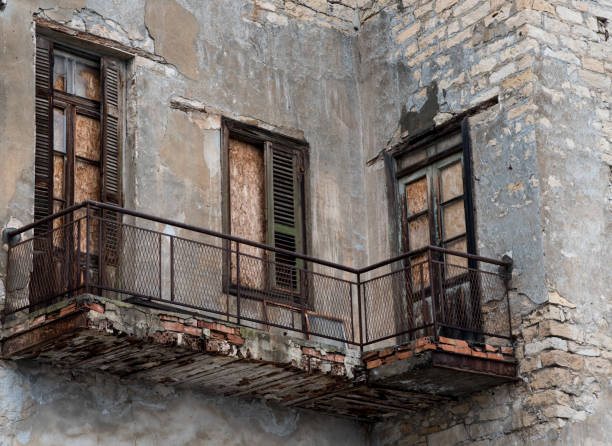 Damaged old vintage house  balconies ready to collapse