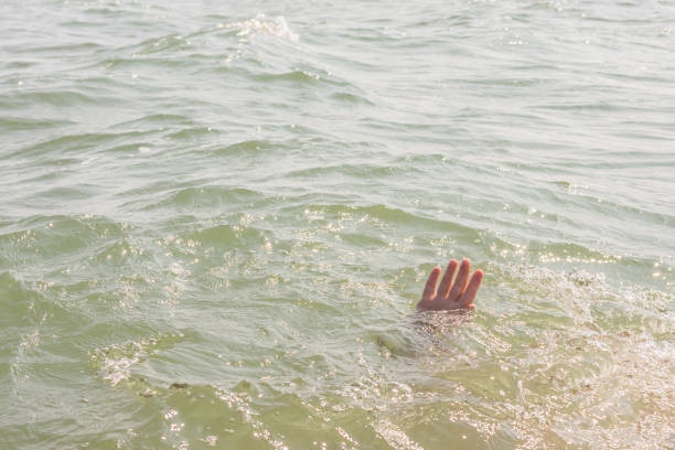 istock A sinking person, the salvation of a drowning man 936273078
