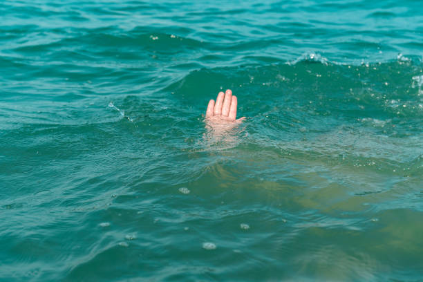 istock A sinking person, the salvation of a drowning man 936273748