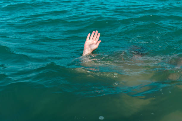 istock A sinking person, the salvation of a drowning man 936274004