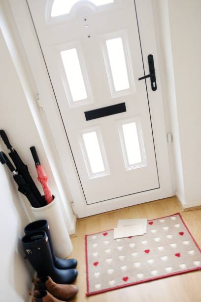 istock Mail on doormat at the front door, England 936274862