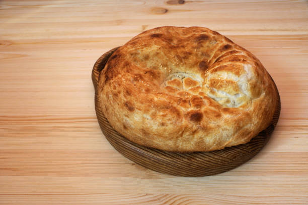 istock Baked bread on a wooden tray 936275178