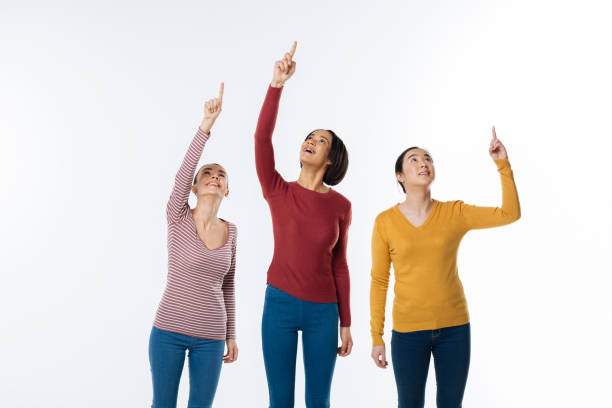 istock Attractive pleasant women looking up 936275600