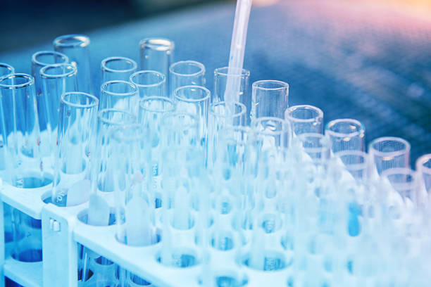 Lab science research Lab science research glass items adding drop to one of several test tubes. A scientific experiment in a science research Laboratory. farmacia stock pictures, royalty-free photos & images