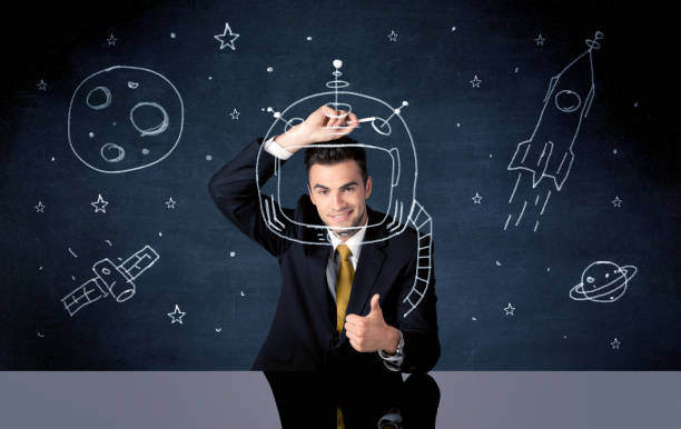 istock Sales person drawing helmet and space rocket 936280738