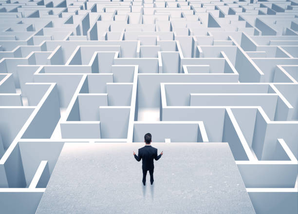 istock Businessman staring at infinite maze 936283864