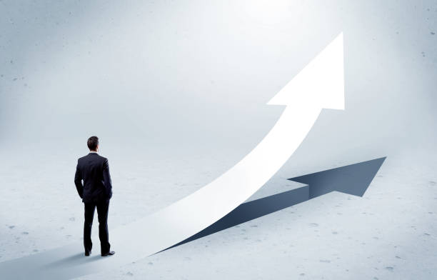 istock Arrow pointing up with standing salesman 936284454