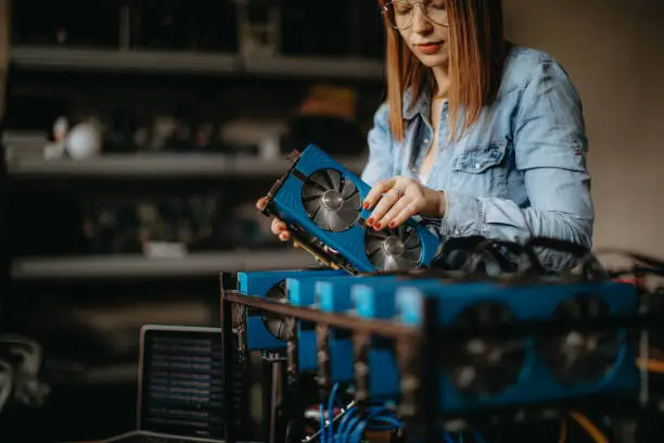 Photo of Young redhead building a miner