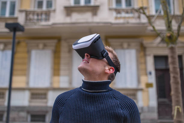 istock Man playing virtual games on street 936286234