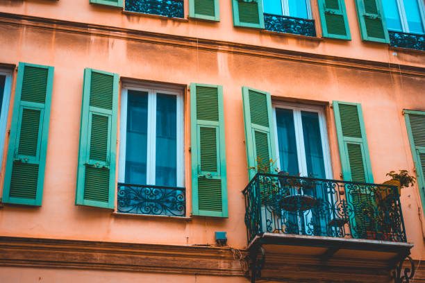 istock detailed view of ancient facade with green windows 936288956
