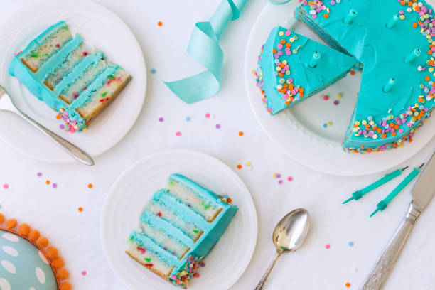 Birthday cake from above Birthday cake with colorful frosting and sprinkles birthday cake green stock pictures, royalty-free photos & images