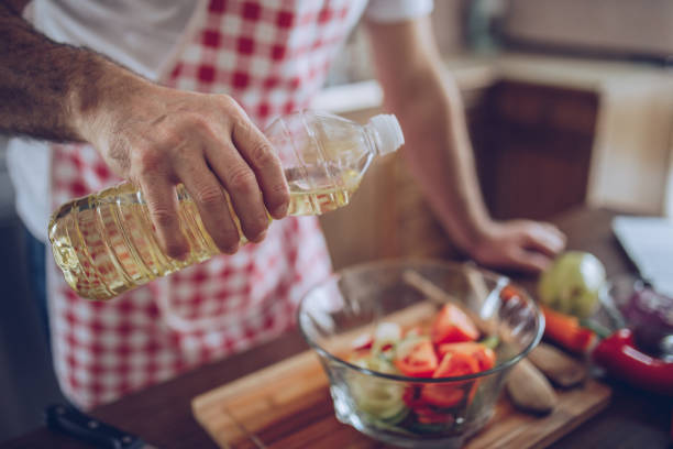 istock Putting oil on salad 936293246