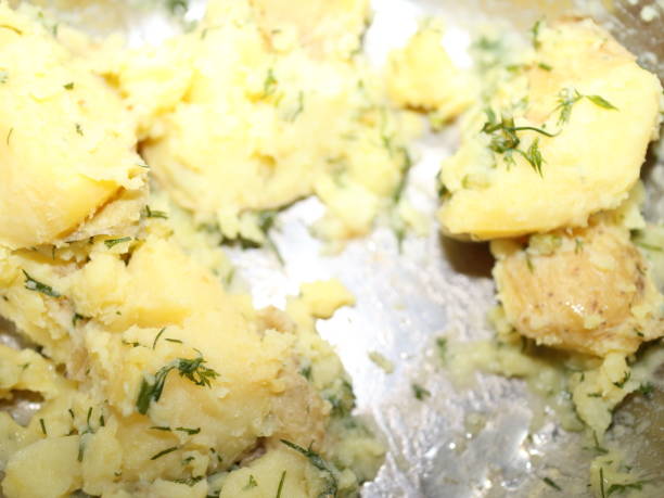istock boiled potatoes with butter and dill in a saucepan 936295062