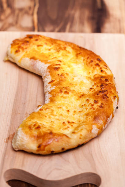 istock khachapuri (ghvezeli) in a half moon form for christmas day, Georgia 936295694