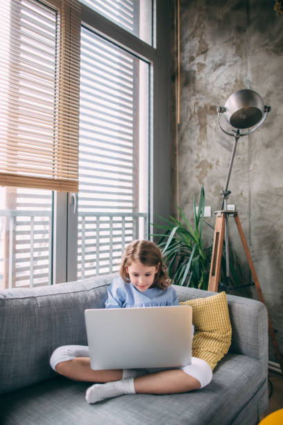 istock Little girl with laptop 936298446