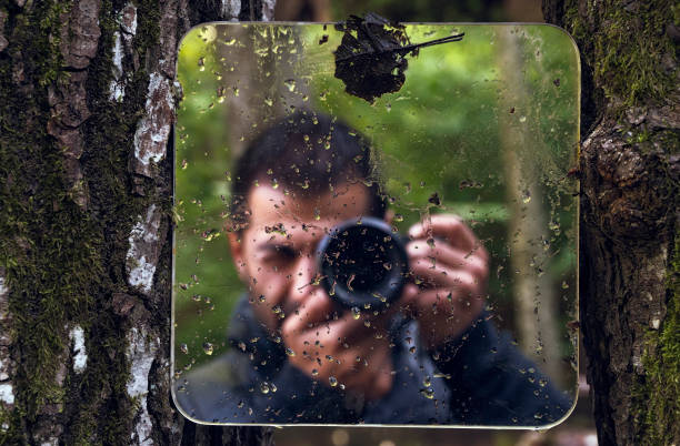 Self portrait by the mirror in nature