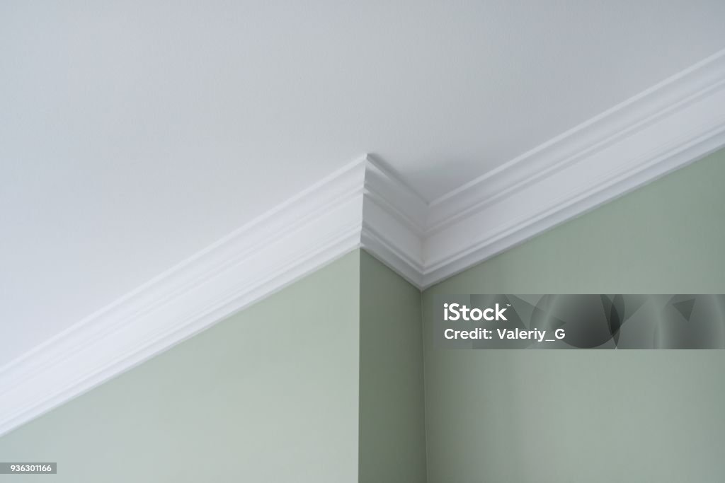 Ceiling moldings in the interior, detail of intricate corner. Ceiling moldings in the interior, a detail of intricate corner. Moulding - Trim Stock Photo