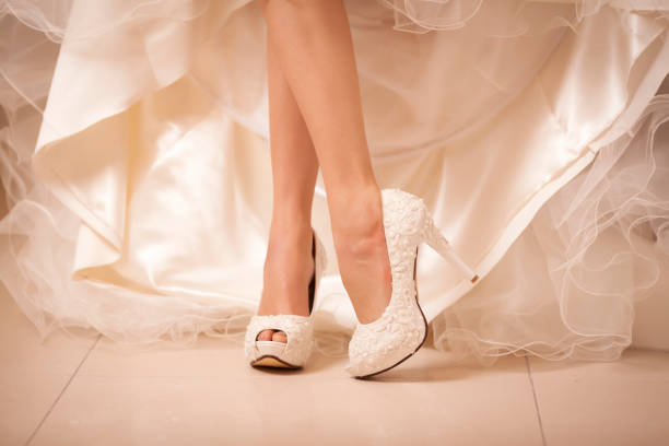 Bride Heels Close-up bride foots with white high heels wedding shoes stock pictures, royalty-free photos & images