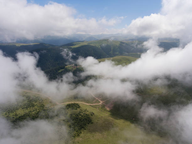 istock Aerial view of mountain village under clouds 936304806