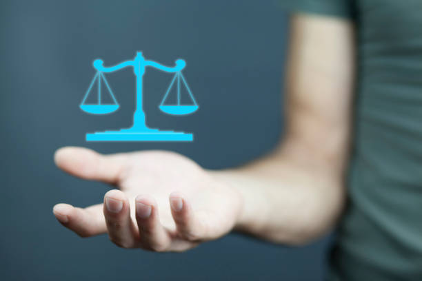 istock businessman hand  scales in screen 936305090