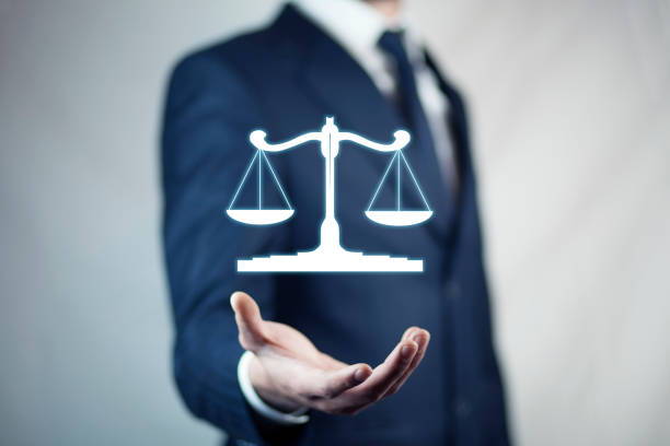 istock businessman hand  scales in screen 936305174
