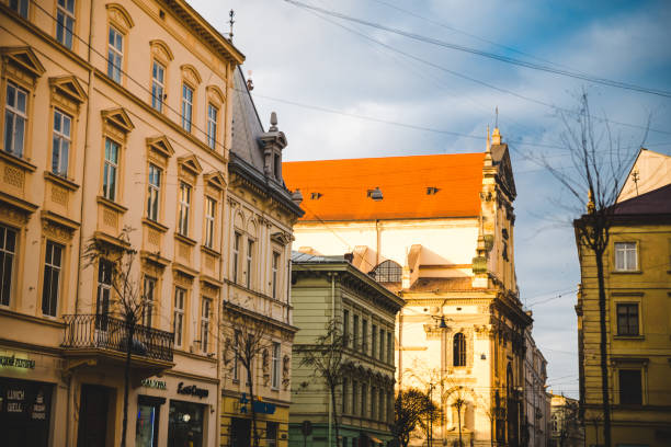 istock old european church tower on sunset with blue sky and white clouds 936305846