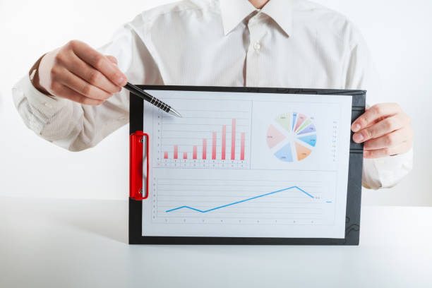 istock Business financier audit working with laptop and data annual report. 936307570
