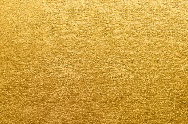 Photo of Gold foil texture. Golden abstract background