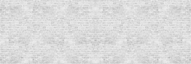 Vintage white wash brick wall texture for design. Panoramic background for your text or image. Vintage white wash brick wall texture for design. Panoramic background for your text or image. graffiti brick wall dirty wall stock pictures, royalty-free photos & images