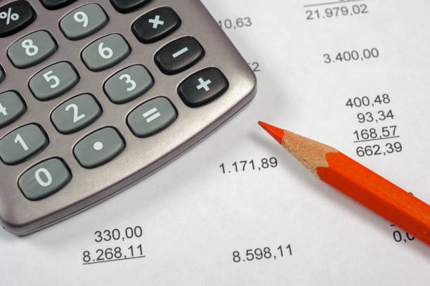 istock financial invoice with calculator and pen 936310470