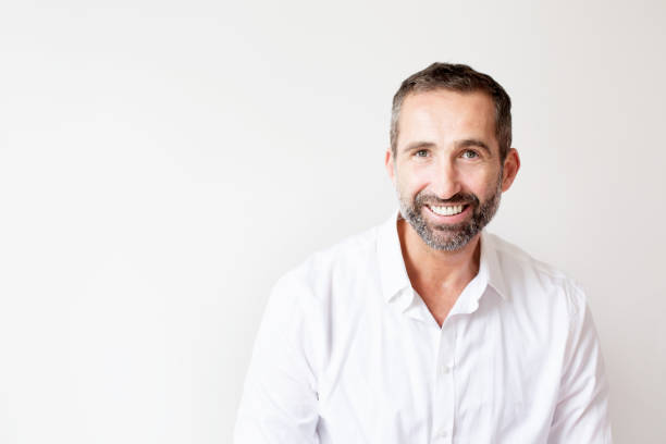 istock handsome bearded man in white shirt 936312106
