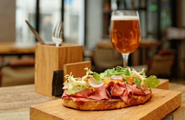 istock Sandwich with roast beef on restaurant table, toned, golden reflector 936312464