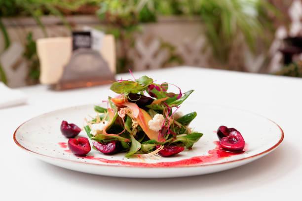 istock Vegetarian salad with berry dressing, toned 936312726