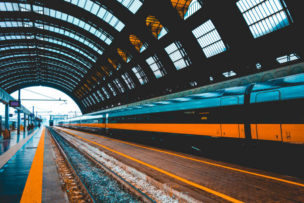 istock orange train in a central station at italy 936313546