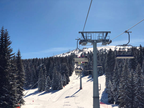 istock People on Ski Chairlift 936314026