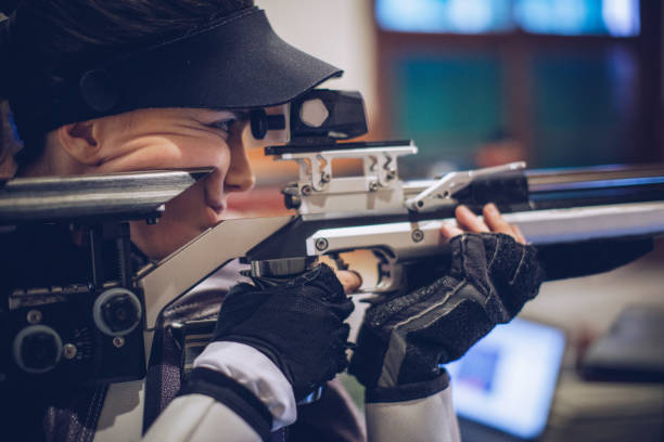 istock Woman sport shooter training 936314078