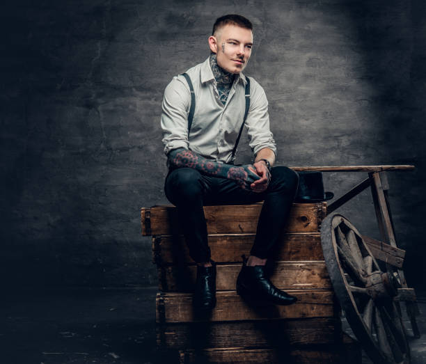 istock A man with a tattoo on his face and arms. 936314222