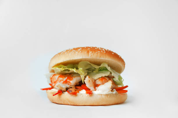 istock burger with shrimps and vegetables isolated on white background 936314268