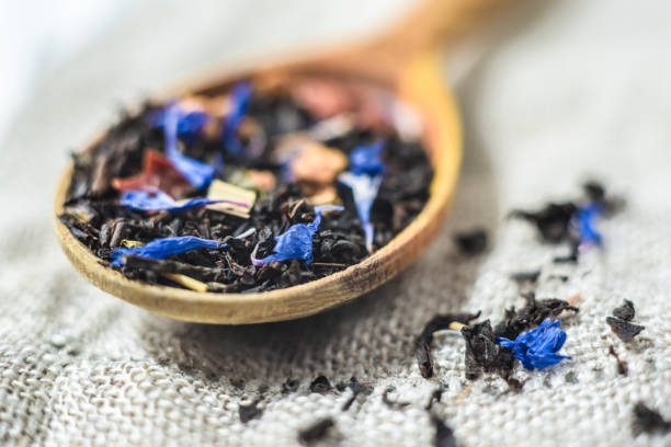 istock black tea with flowers and fruits 936315148