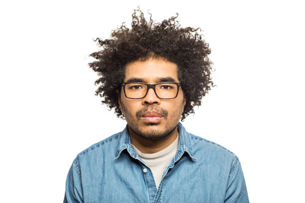 istock Serious young man with eyeglasses and curly hair 936315562