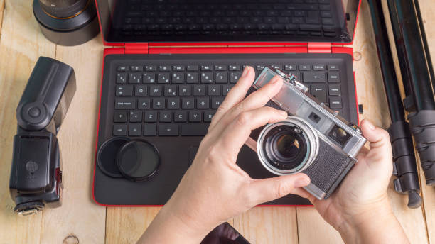 istock desktop with photography equipment 936316098