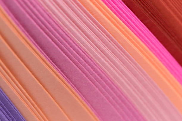 istock Multicolored quilling paper curved stripes forming a bright background. 936316336