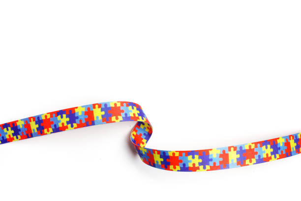 istock World Autism awareness and pride day with Puzzle pattern ribbon isolated on white 936320100