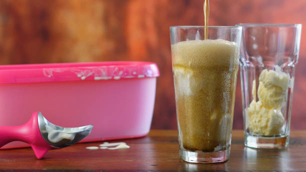 istock Preparing black cow cola ice cream soda floats 936320256