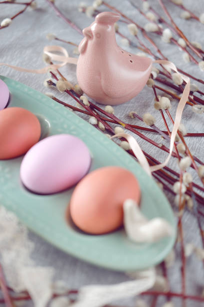 istock Easter holiday decoration.  Egg cup with painted egg, lace and willow branches. 936324166