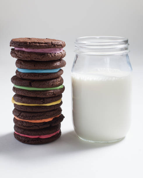 Rainbow Sandwich Cookies with Milk stock photo