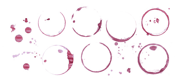Dry stains of red wine glass or bottle circle rings and blob drops isolated on white background