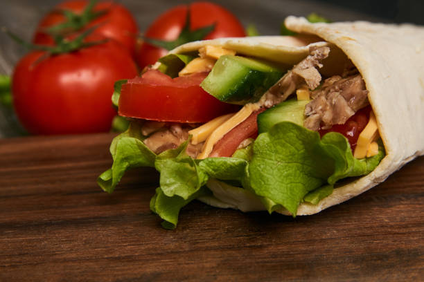 istock Burrito with grilled chicken and vegetables lettuce 936325794