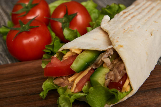 istock Burrito with grilled chicken and vegetables lettuce 936326088
